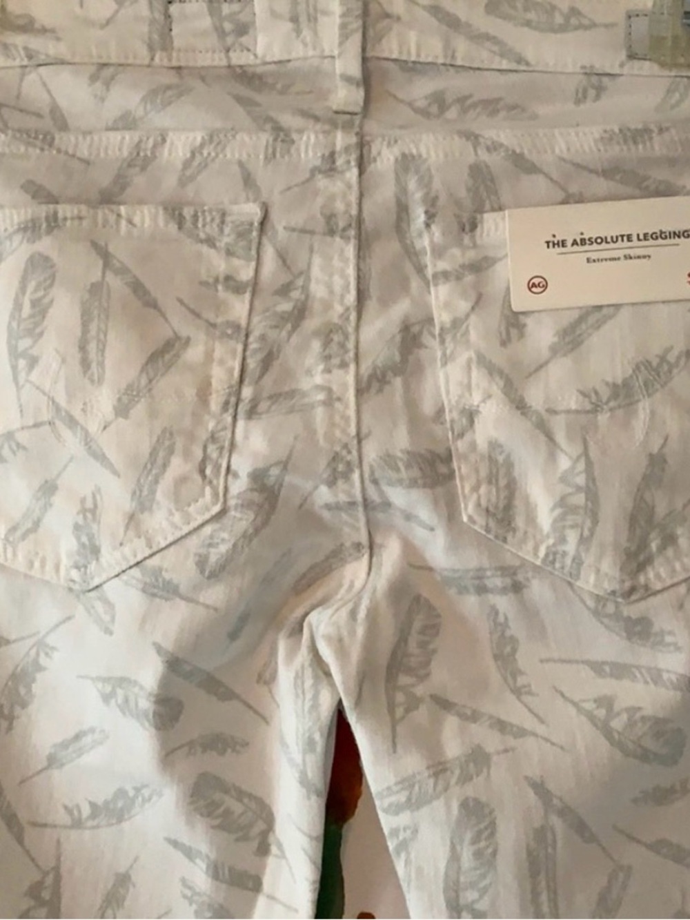 AG white jeans w/soft green feather print so cute!